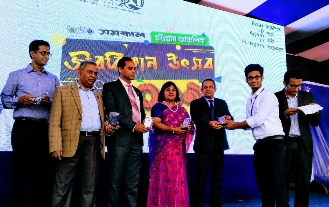 Receiving prize in Bangladesh Biology Olympiad